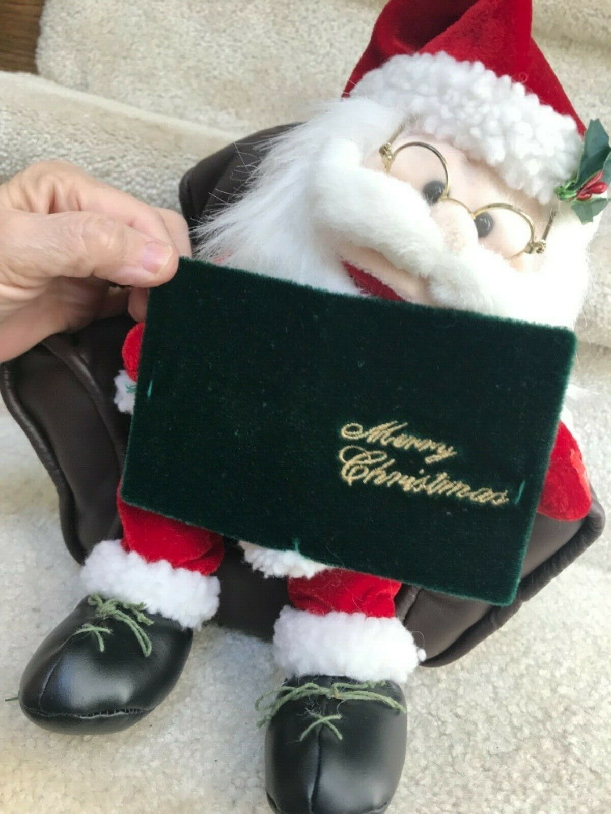 Pan Asian Animated Santa In Chair Reading 